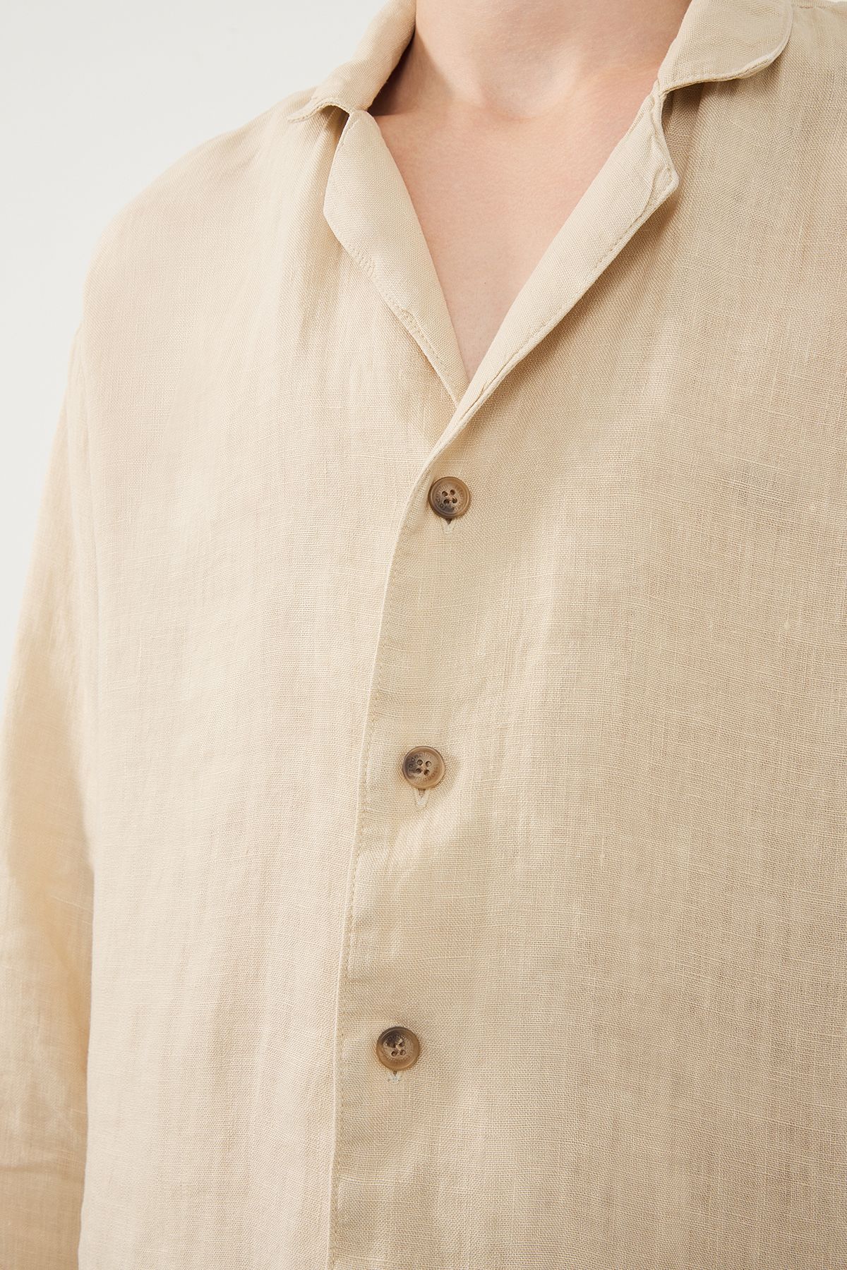 Close-Up of Linen Fabric Texture and Buttons on Beige Shirt