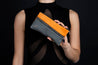 Woman holding the iconic  pencil case Alan by Alberto Olivero 