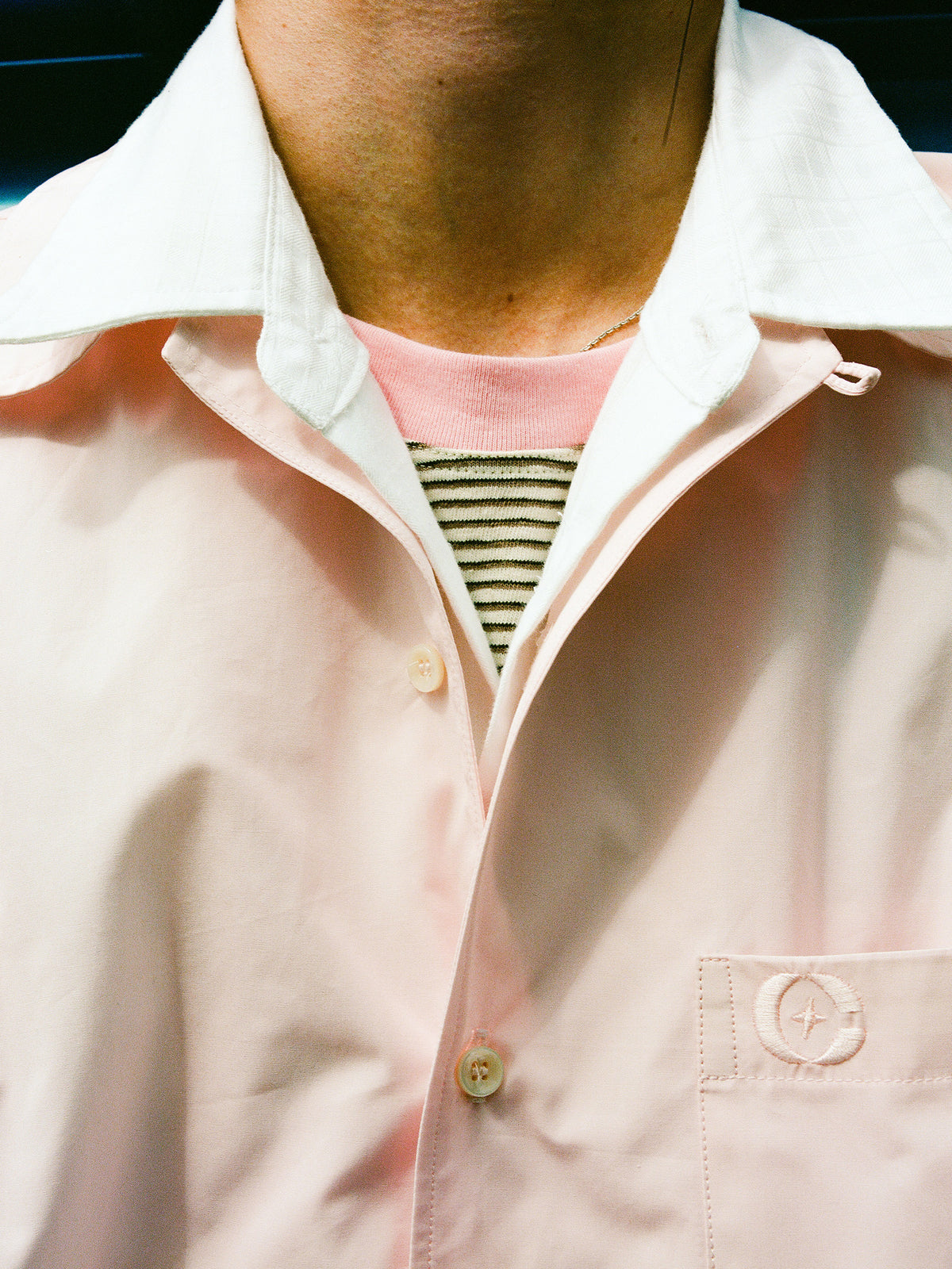 Close-up of pink Biasca Bowling Shirt pocket detail with C Star logo embroidery