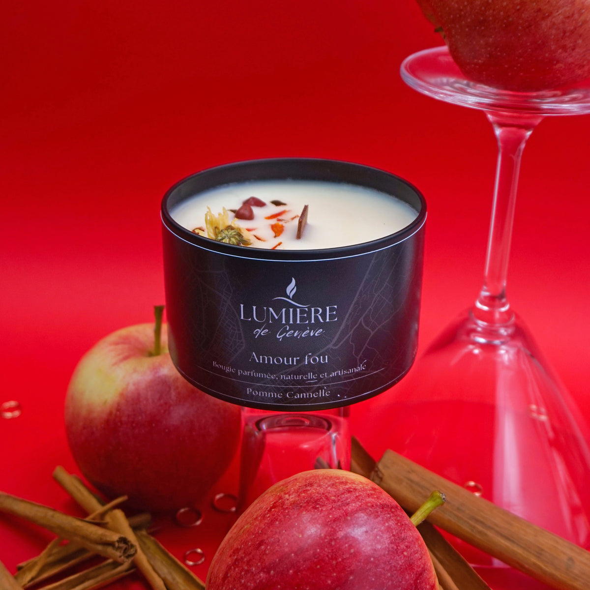 Lumiere de Geneve Apple Cinnamon Candle sourrounded by Apples and Cinammon