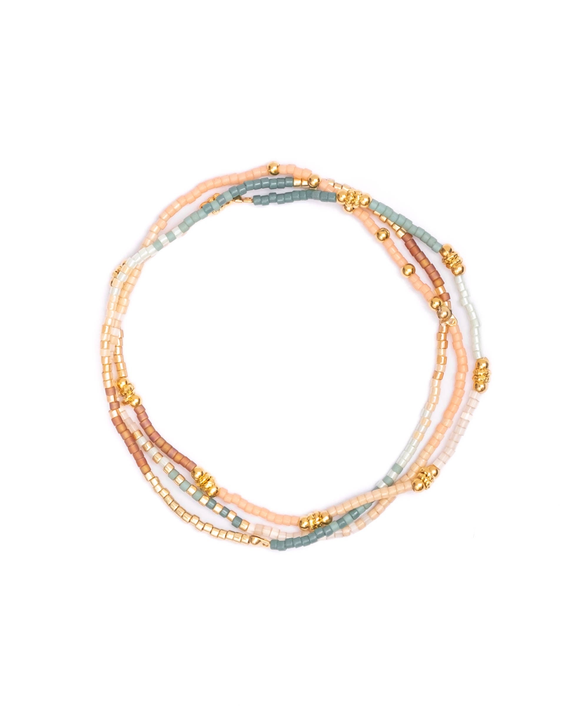 Close-up of Miyuki Beaded Stretch Bracelet Trio in Peach, Aqua, and Turquoise with gold-filled accent.