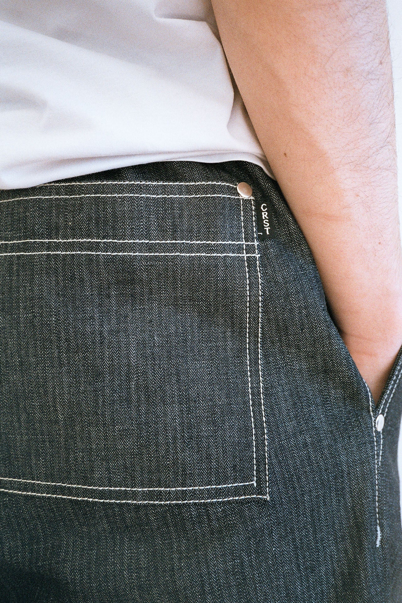 Close-up detail shot of the herringbone pattern on the premium Japanese denim fabric used for the Men's Jeans by Crest.